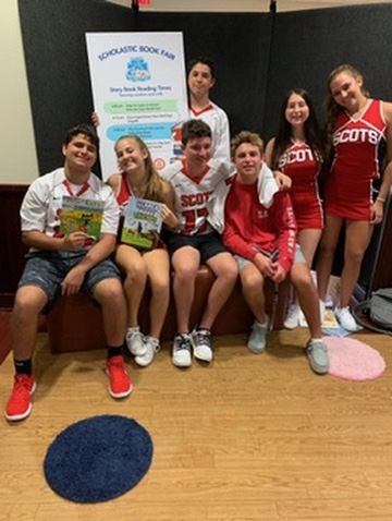 Teen volunteers at the Scholastic Book Fair