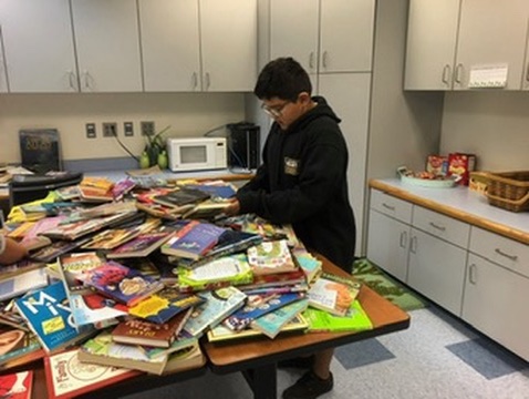 Sorting through a mountain of donated books